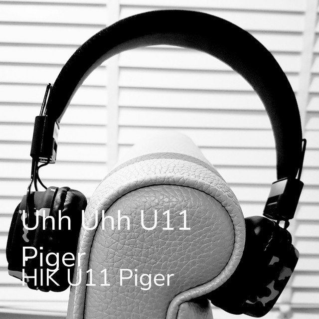 Cover til Uhh Uhh U11 Piger: sort-hvidt foto af et par høretelefoner